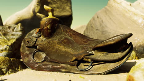 very-old-horse-saddle-on-sand-beach